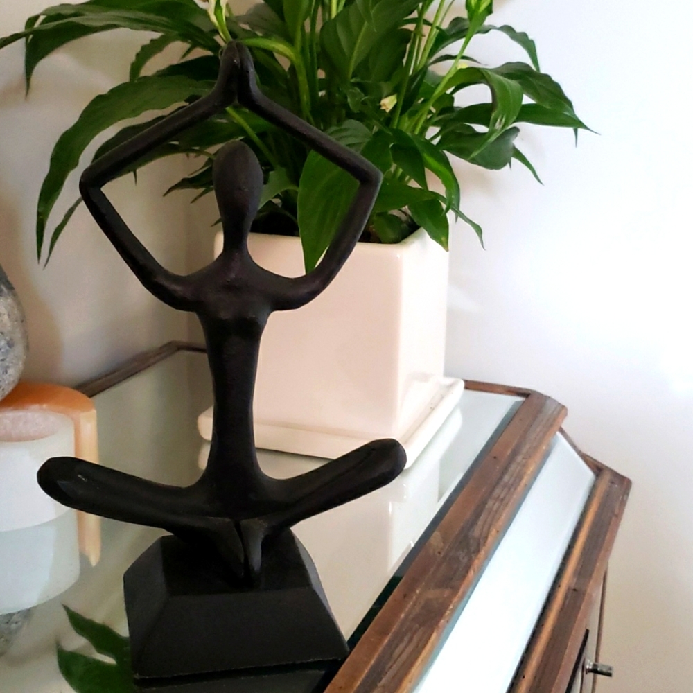 Yoga figure sitting statue